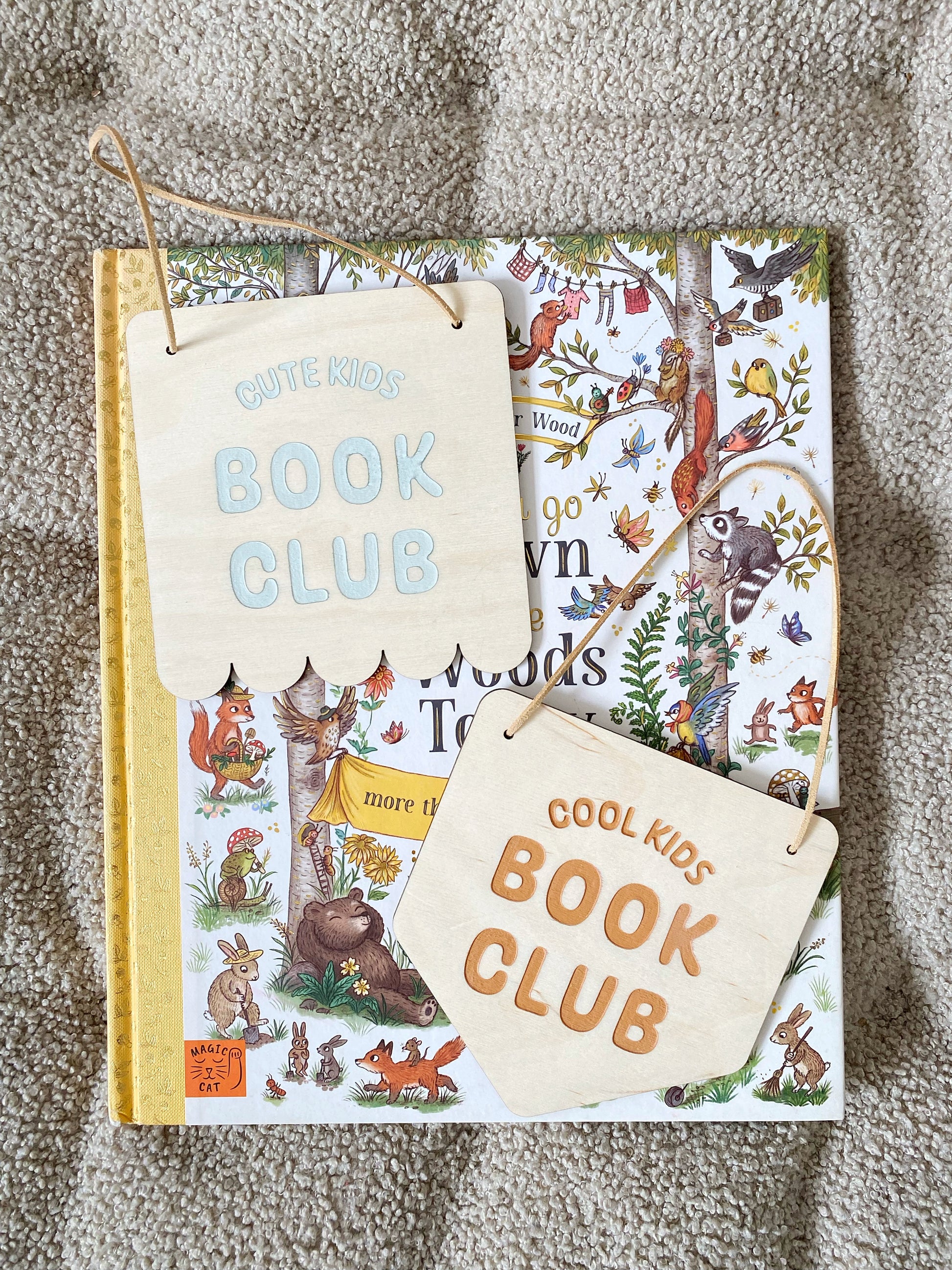 Children's book with animal illustrations and a matching pouch on a textured surface