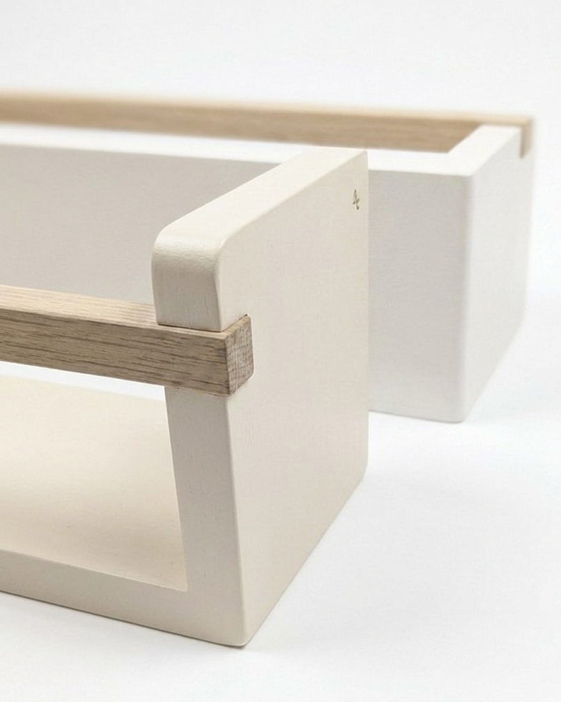 Minimalist white shelf with wooden bar on a white background