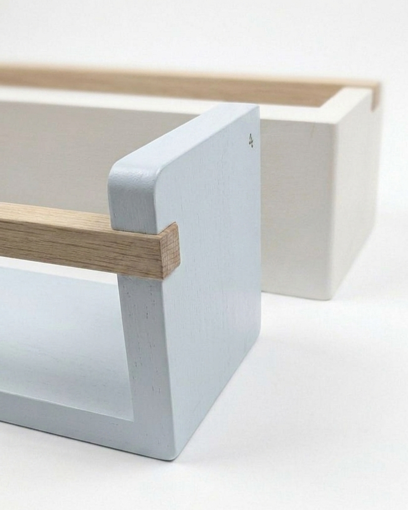 Minimalist design with white concrete base and wooden top on a light background