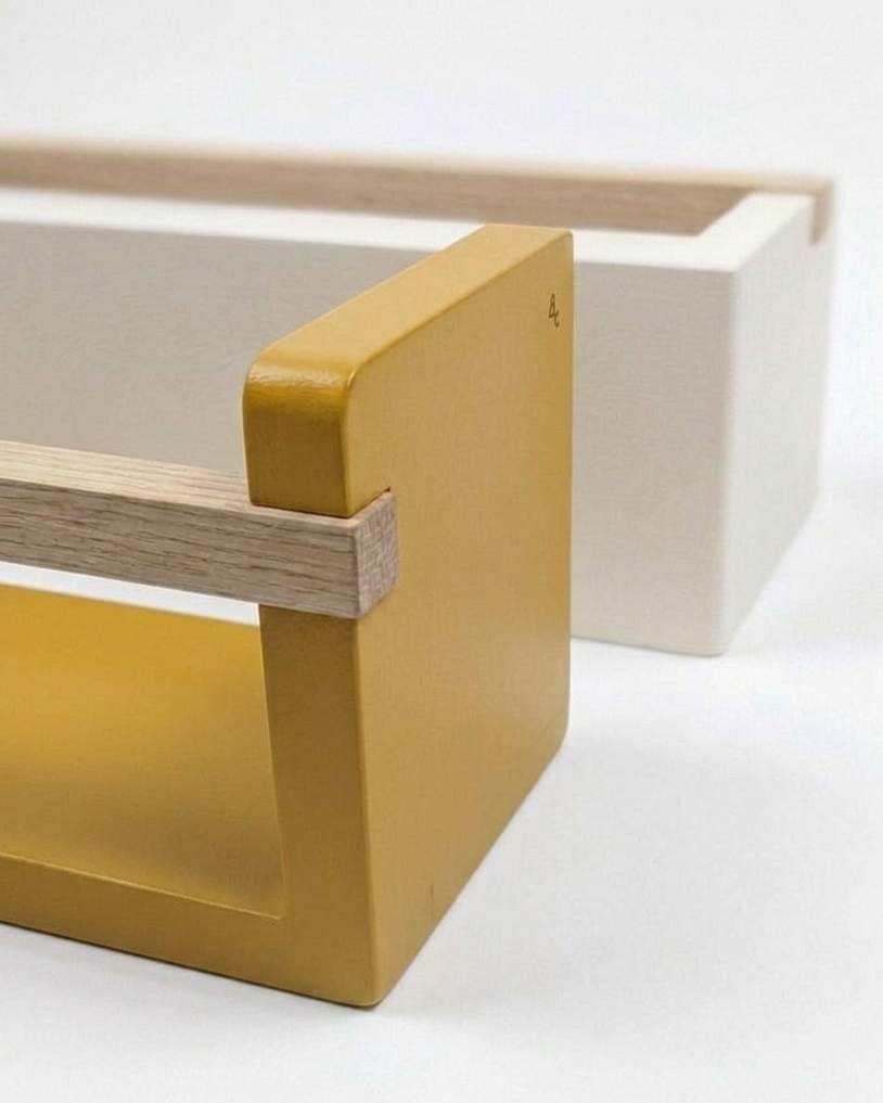 Rectangular wooden block with yellow corner on a white background