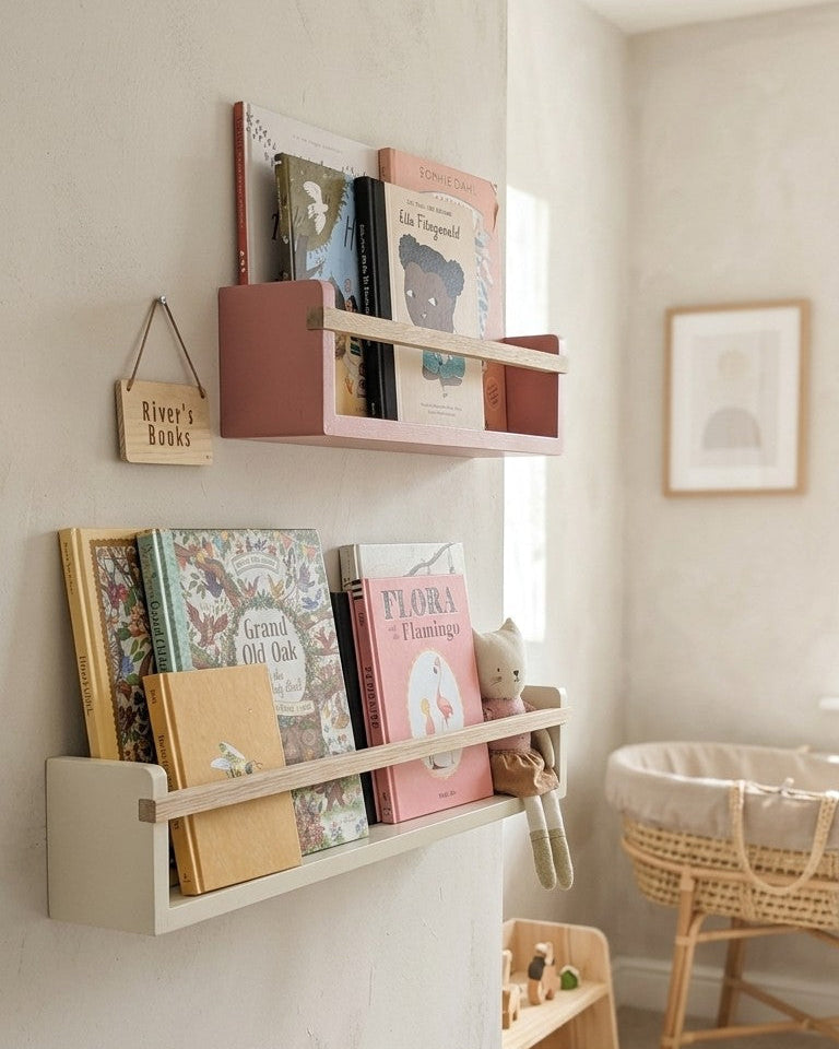 Nursery with wall-mounted bookshelves displaying children's books and a wooden crib.