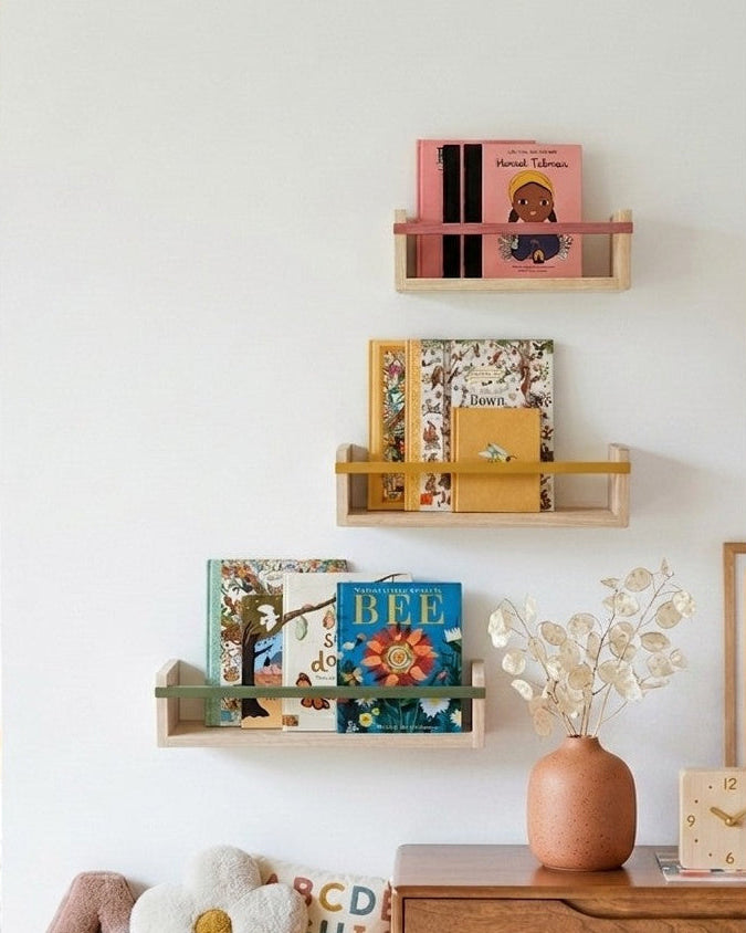 The Story Shelf by Autumn's Corner in natural ash displayed on a white wall with children's books and nursery decor