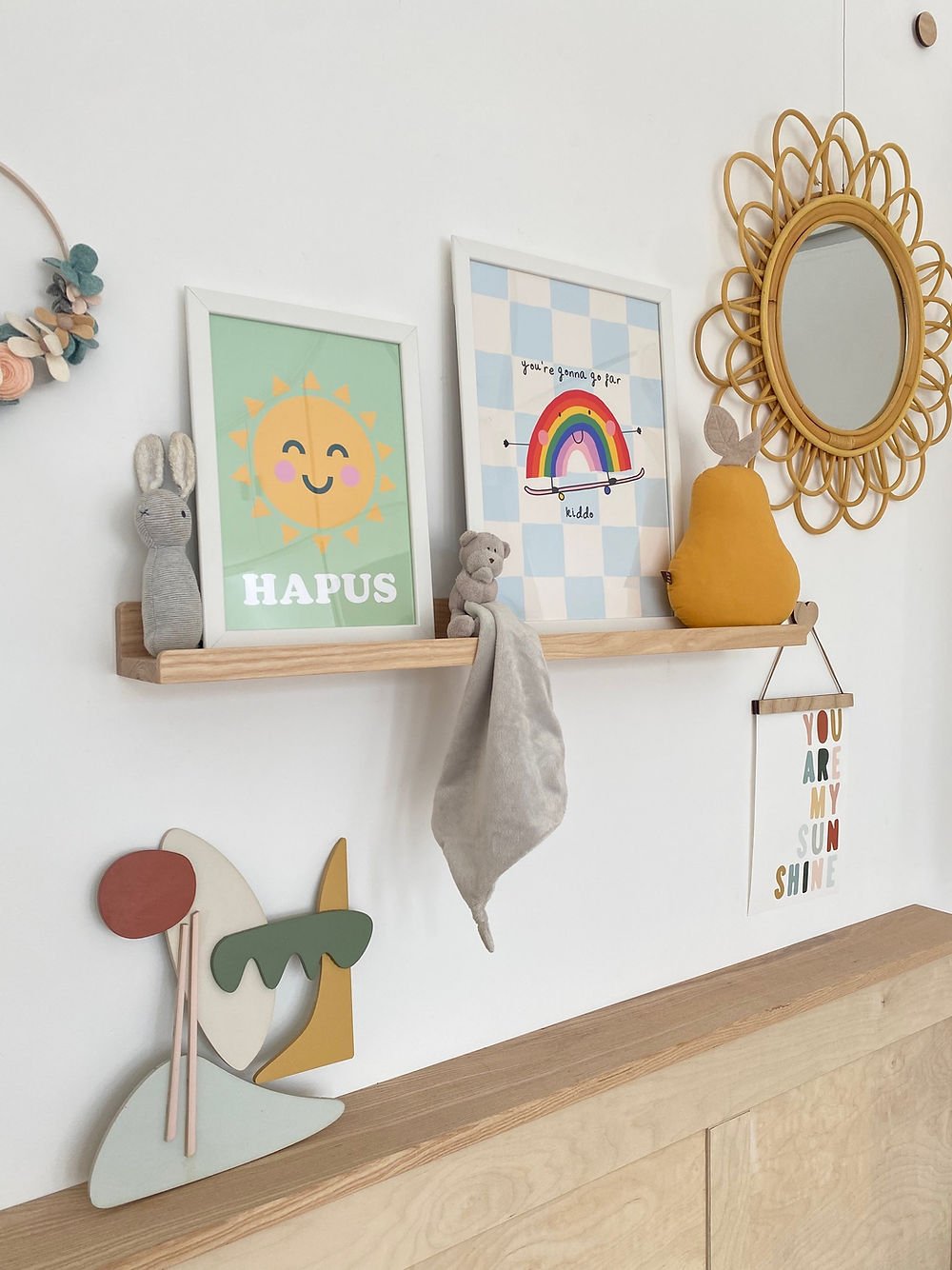 Book and Picture Ledge by Autumn's Corner in solid ash, holding children's prints and soft toys above a sideboard